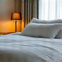 Peaceful, comfortable bed with soft lighting