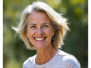 Smiling woman in her late 40s, engaging in light exercise outdoors.